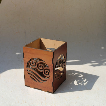 Tea light holder cum pen stand